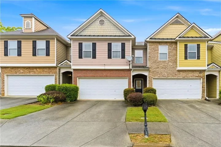 Craftsman-style home featuring driveway and a garage