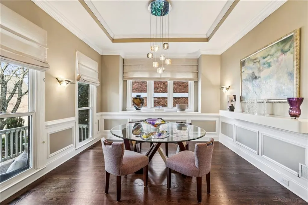 Dining Room with interesting built-in sideboards and a stunning contemporary light fixture