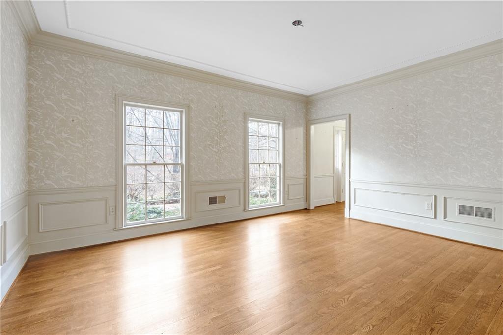 Dining room featuring hardwood wood flooring and ornamental molding