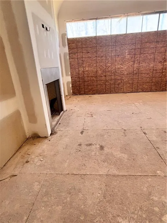 Unfurnished living room featuring a fireplace