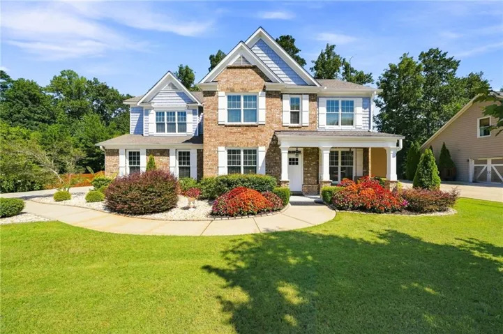 Brick and siding exterior with a covered porch