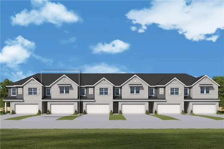 Modern townhome community featuring elegant exterior architecture with peaked rooflines, multi-pane windows, and neutral facade finishes