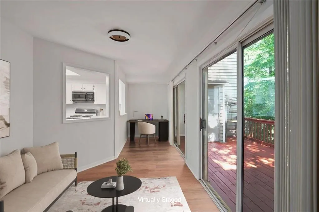Sun Room with Access to Back Deck (virtually staged)