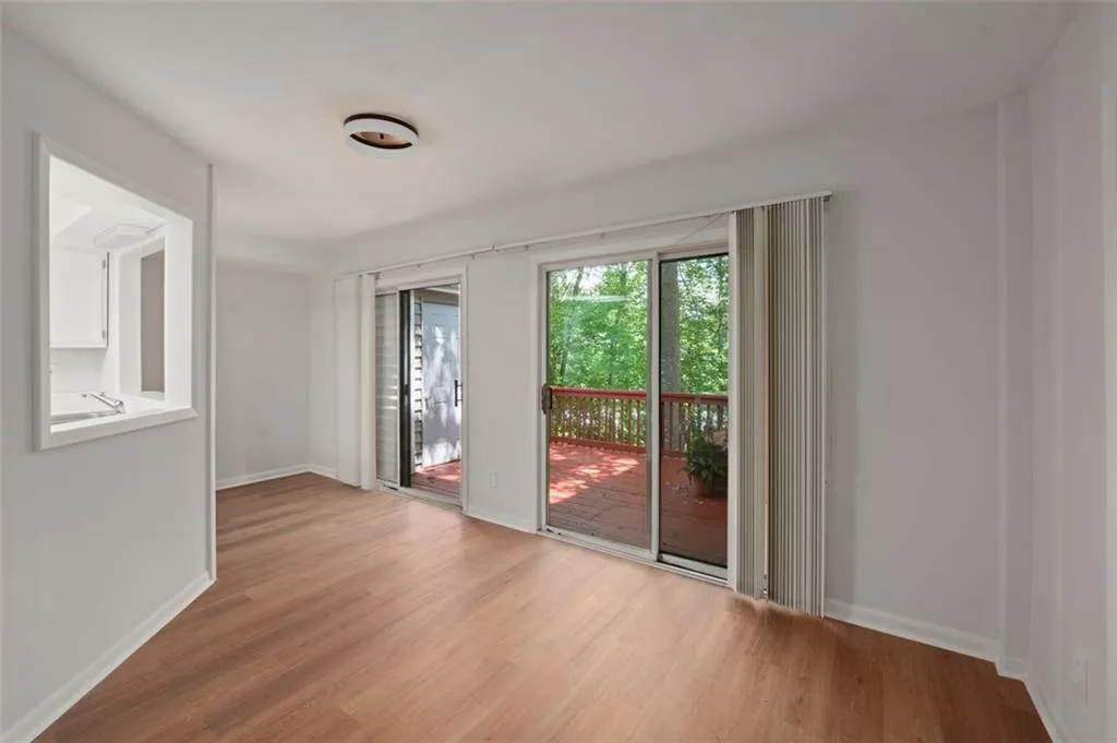 Dining Room/Sun Room looking to kitchen from great room with access to Back Deck.