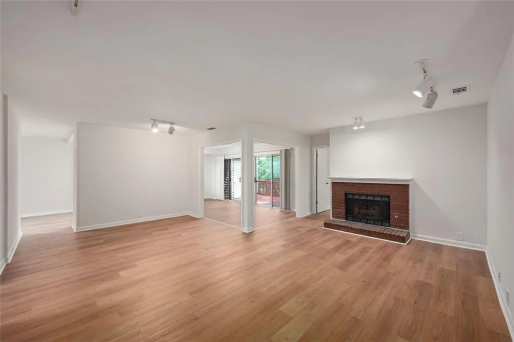 Generous great room with new flooring, paint , and smooth ceilings!
