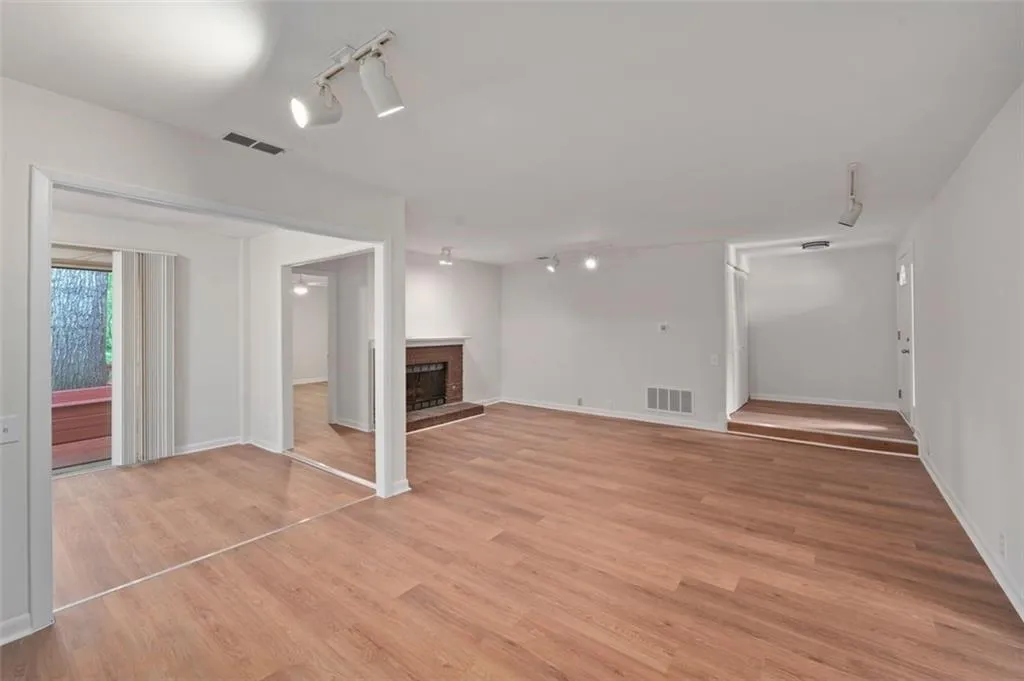 Large Open Concept with New Flooring, Paint, Hardware, Smoothed Ceilings and Natural Sunlight!