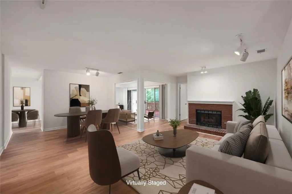 Generous great room with new flooring, paint , and smooth ceilings! (virtually staged)