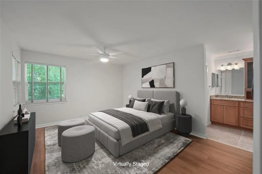 Large primary suite with new flooring, paint, fixtures, and smooth ceilings! (virtually staged)
