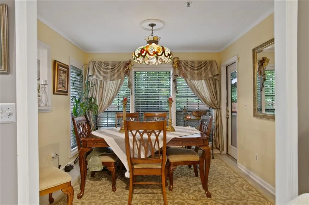 Dining area featuring baseboards and ornamental molding