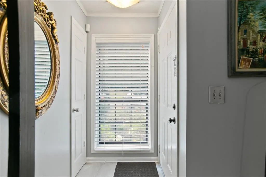 Entryway featuring crown molding