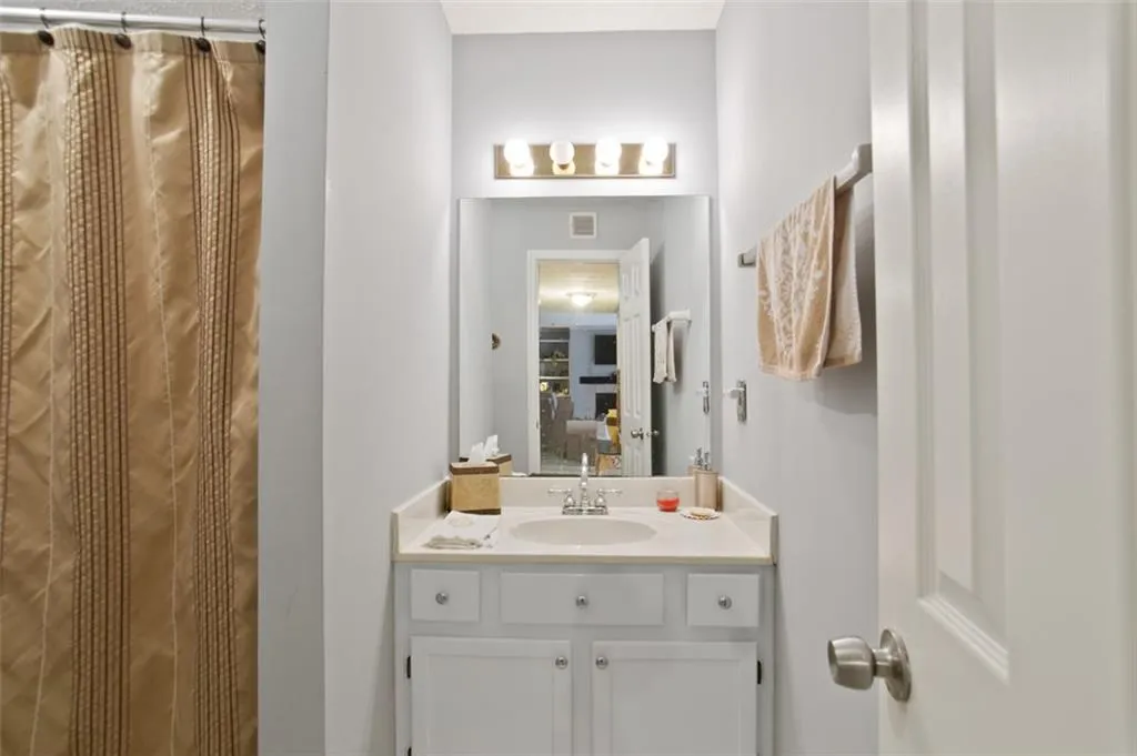 Bathroom with vanity and a shower with curtain