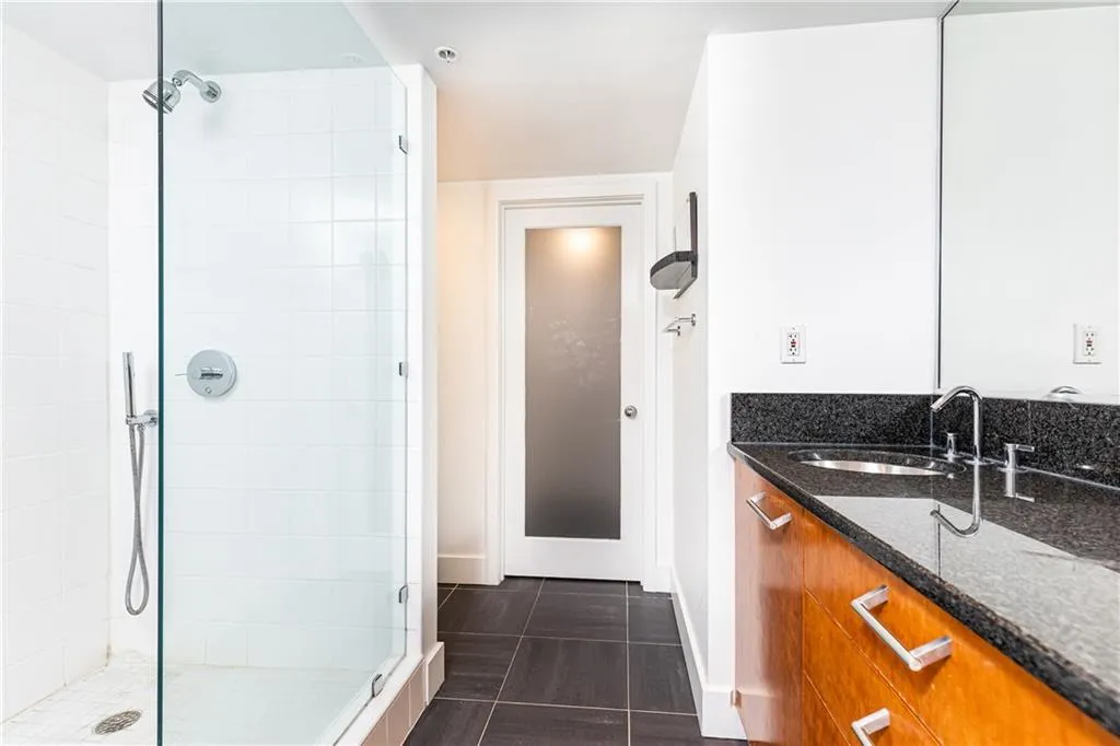 Bathroom with a stall shower and vanity
