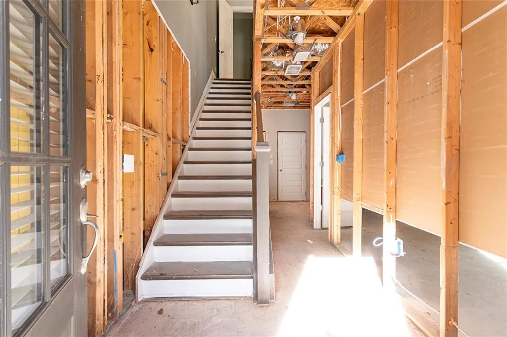 Stairway with unfinished concrete flooring