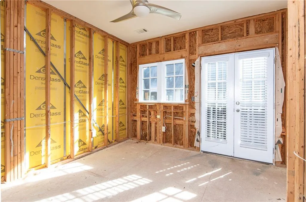 Miscellaneous room featuring french doors, ceiling fan, and healthy amount of natural light