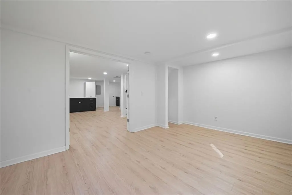 Bedroom #5. French doors. Perfect for a gym, media room, or an office. View to family room/in law