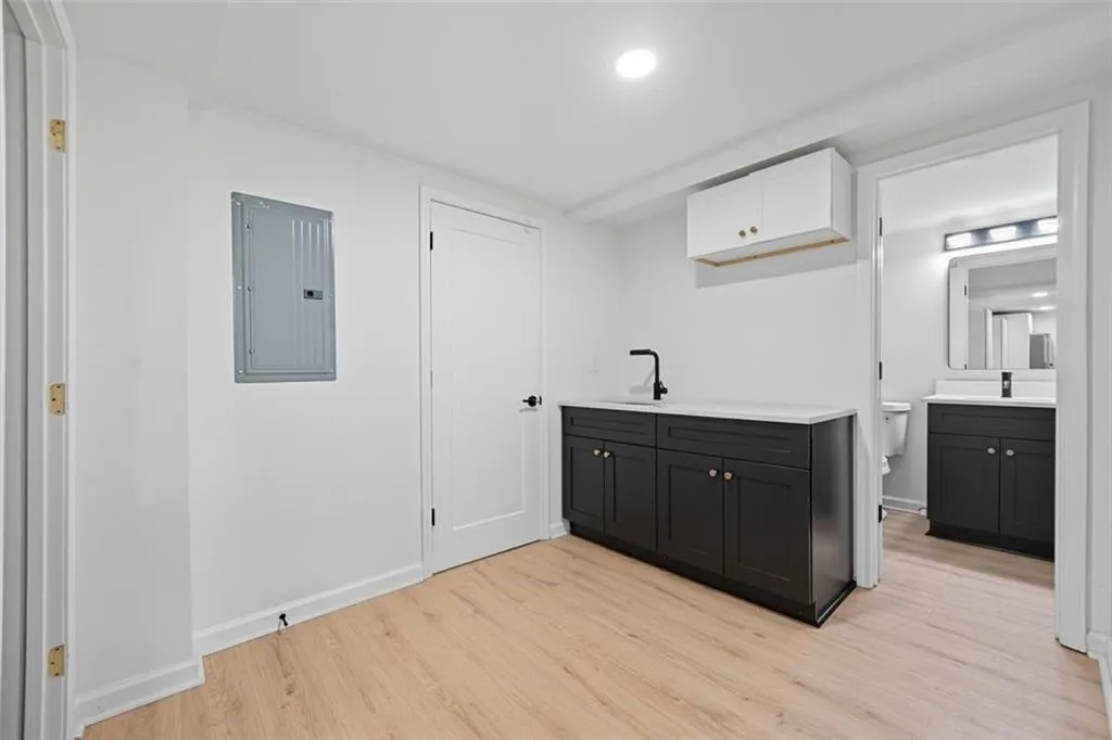In law suite sink and cabinet hardwired for microwave, & view of Bathroom #3