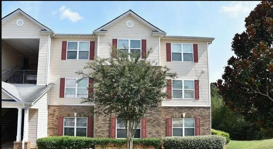 Multistory building with brick and siding exterior