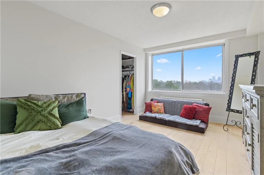 The hardwood floors continue into the oversized bedroom. Spacious enough for a dresser and a sitting area.