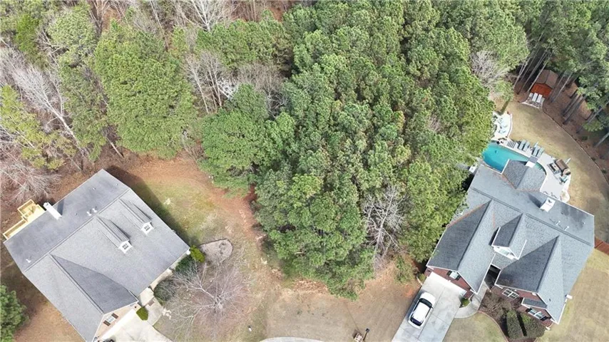 Drone / aerial view of a heavily wooded area