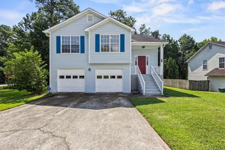 Light blue siding exterior with white trim and dark blue shutters
