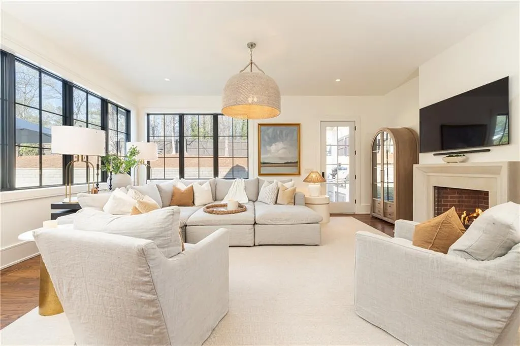 Family room with fireplace and windows to yard