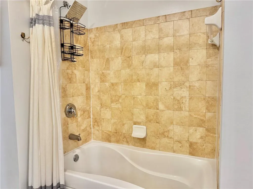 Full bathroom featuring shower / tub combo