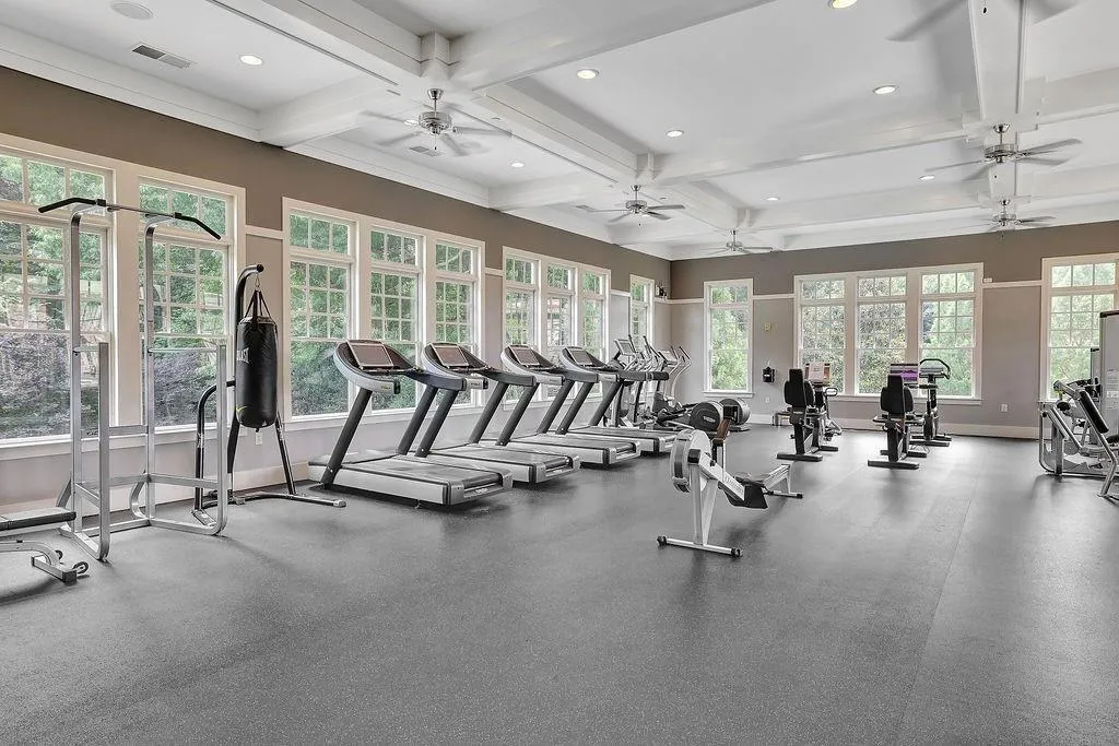 Workout area featuring recessed lighting, beamed ceiling, and coffered ceiling