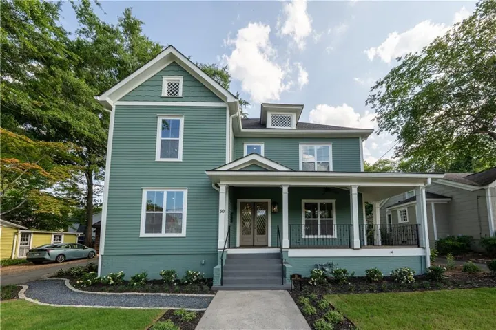 Two-story exterior with horizontal siding and white trim accents