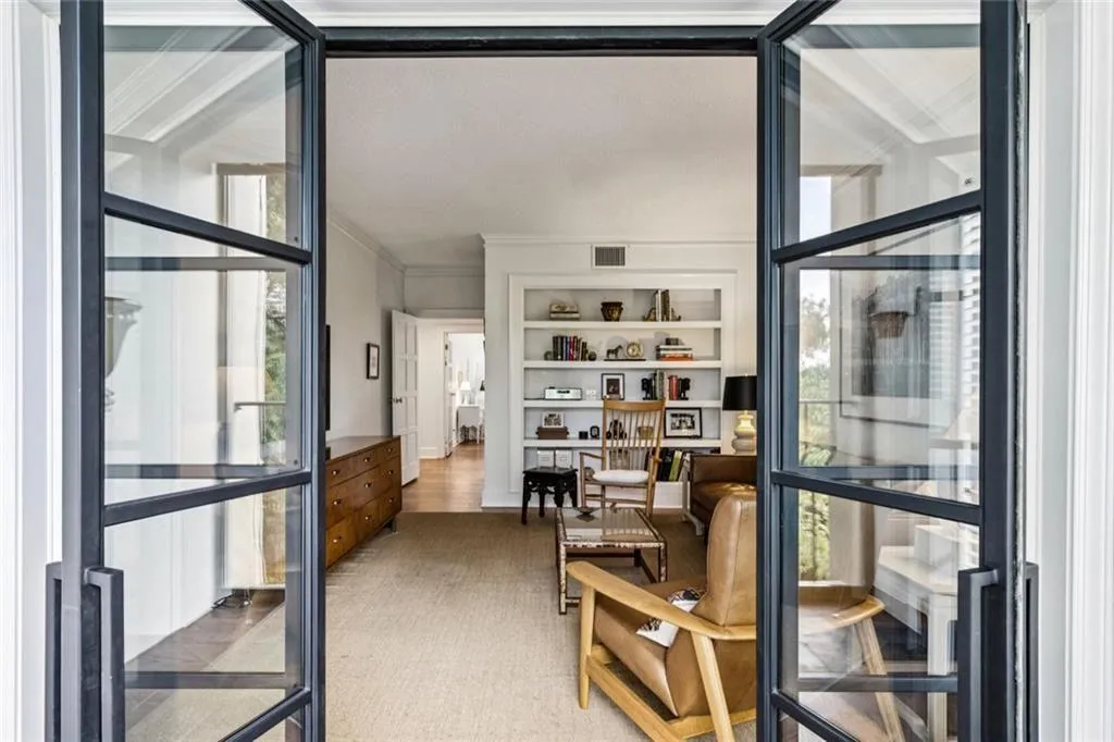 Indoor/outdoor porch, off of the Den...guest room in the distance!