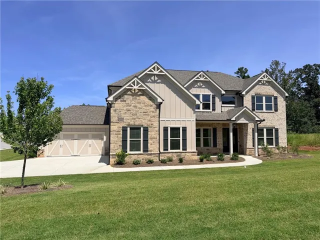 Stone and board and batten siding exterior