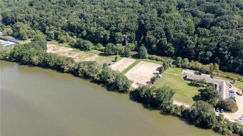 Bird's eye view of a nearby body of water and a forest