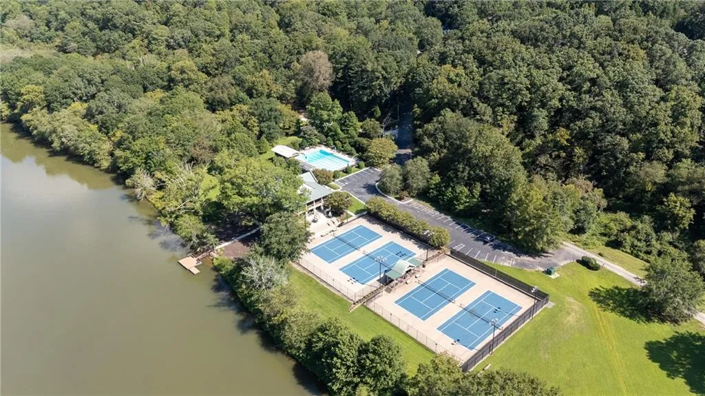 Bird's eye view of a large body of water and a heavily wooded area