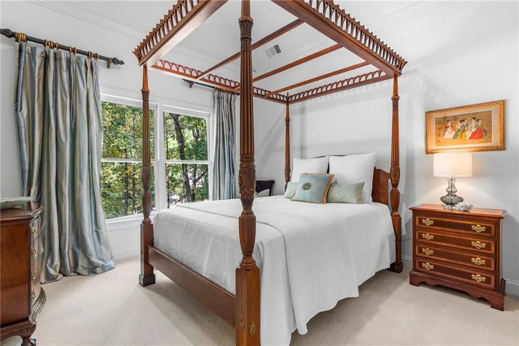 Secondary Bedroom featuring 10’ ceiling with tray, ornamental molding with spacious walk-in closet Secondary Bedroom featuring 10’ ceiling with tray, ornamental molding with spacious walk-in closet