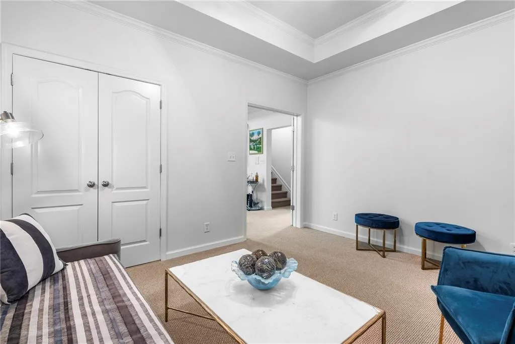 TTerrace-level bedroom includes tray ceiling, fan, a closet, double French doors and provides direct access to the side yard TTerrace-level bedroom includes tray ceiling, fan, a closet, double French doors and provides direct access to the side yard