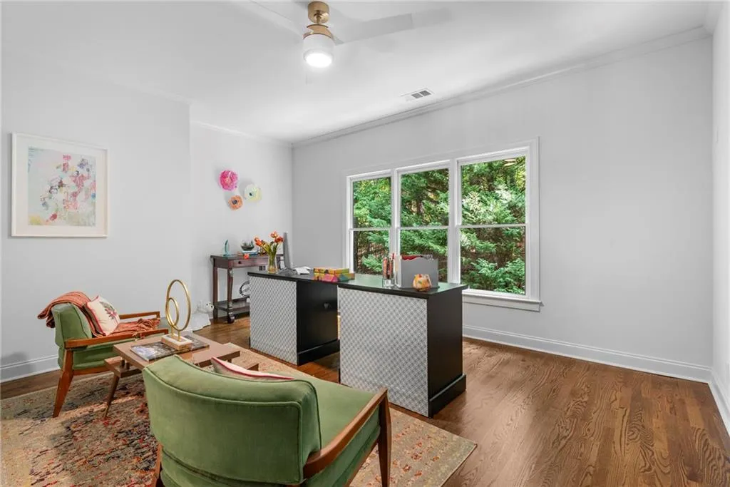 Bedroom/Office featuring crown molding, ceiling fan, hardwood floors and double closets Bedroom/Office featuring crown molding, ceiling fan, hardwood floors and double closets