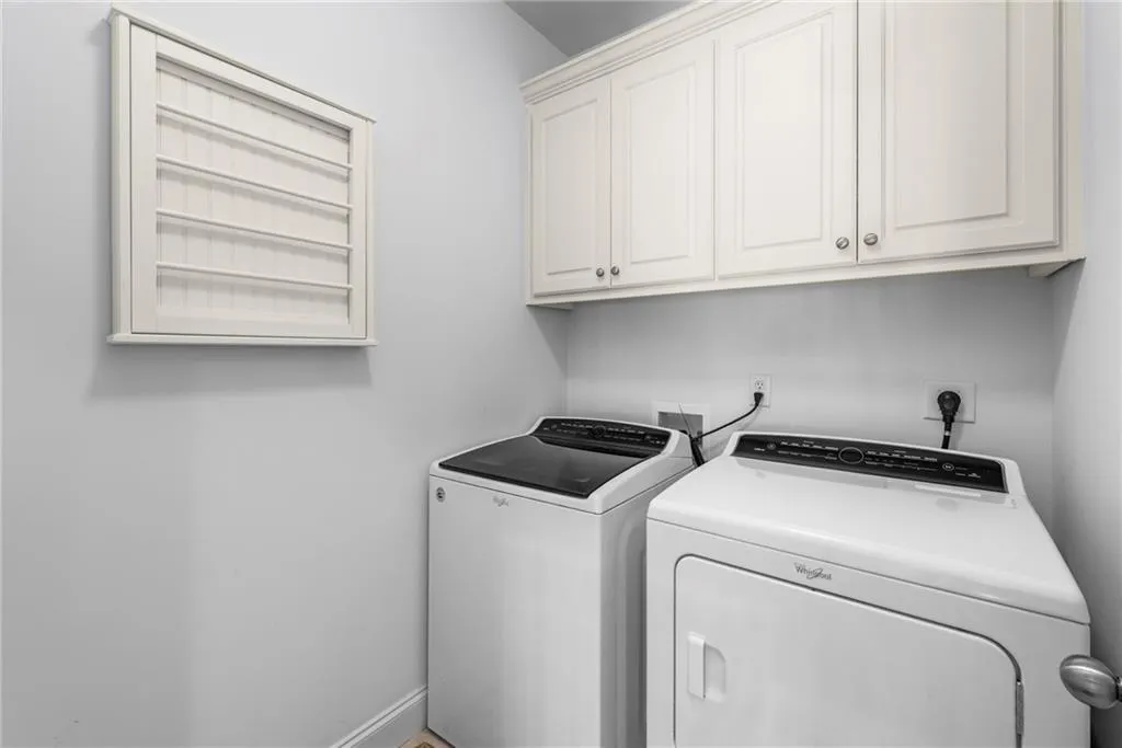 Laundry Room upstairs with cabinet space Laundry Room upstairs with cabinet space