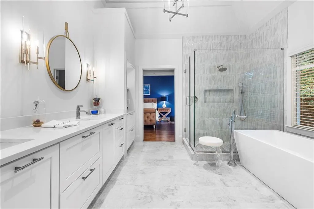 Primary Bath featuring extra-large double vanity with drawer storage. Primary Bath featuring extra-large double vanity with drawer storage.