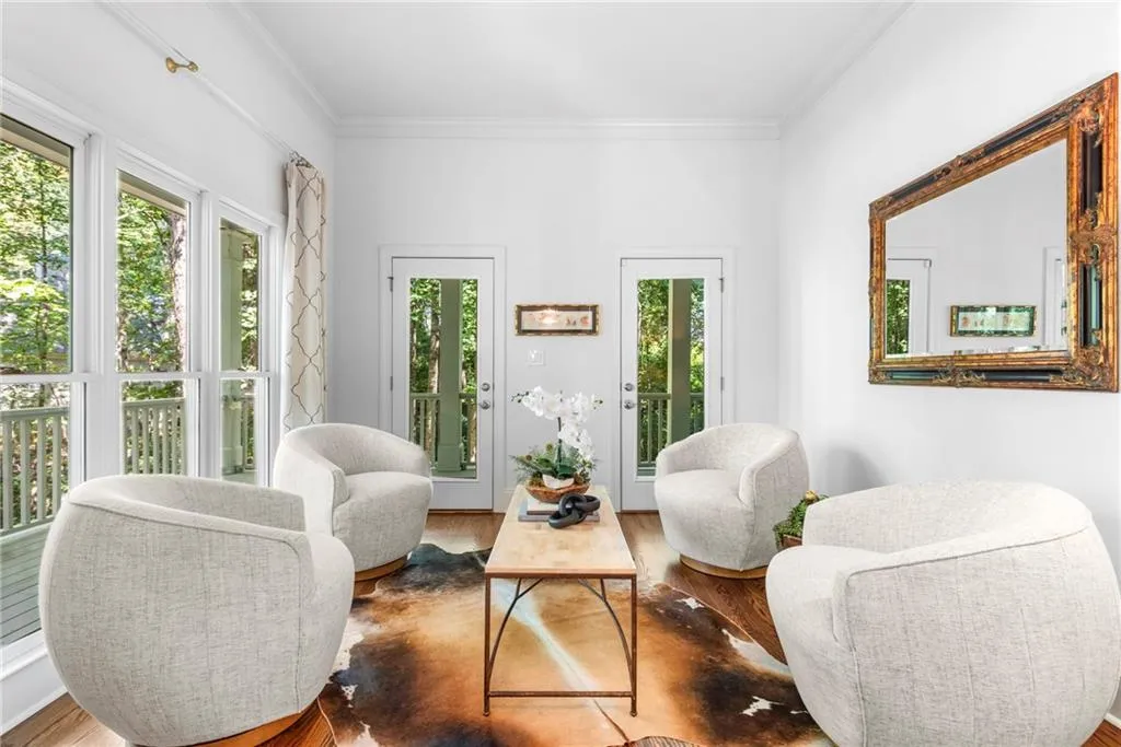 Living/Sitting area with french doors leading to the side porch Living/Sitting area with french doors leading to the side porch