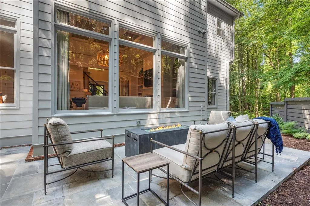 View of patio / terrace with an outdoor fire pit View of patio / terrace with an outdoor fire pit