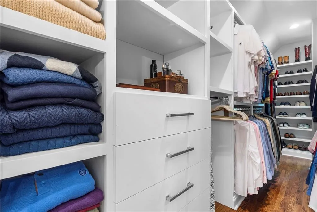 Primary custom walk-in closet Primary custom walk-in closet