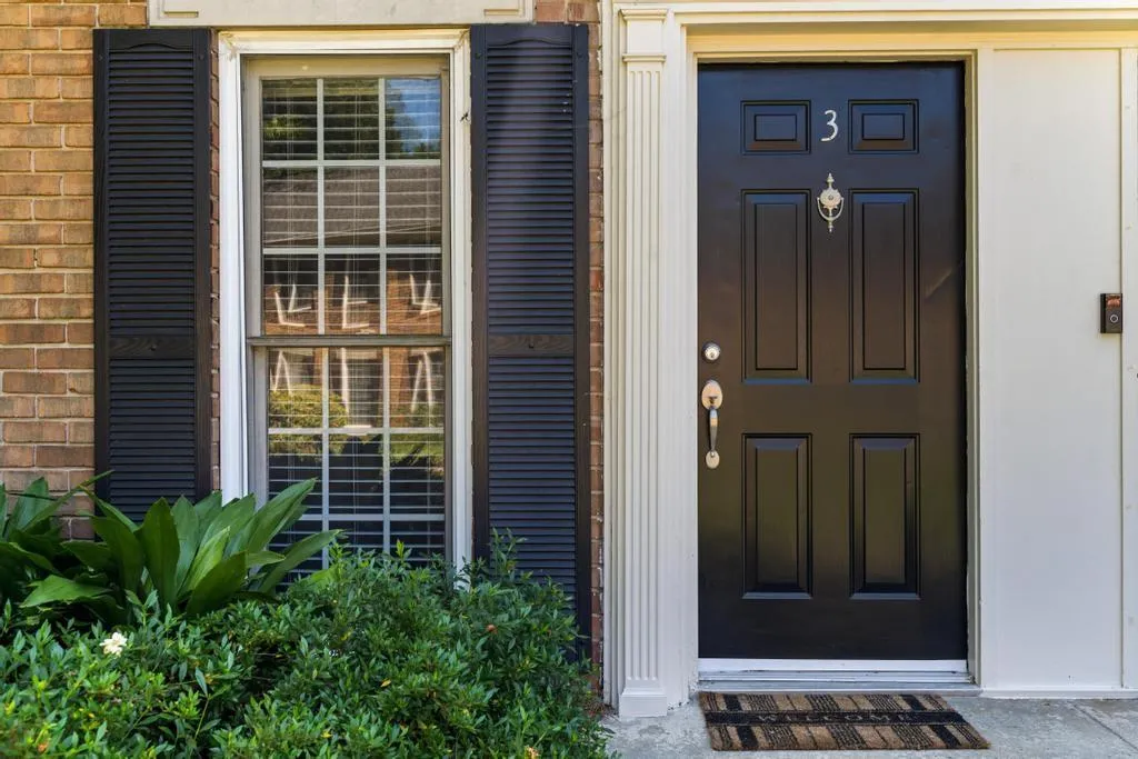 View of exterior entry with brick siding