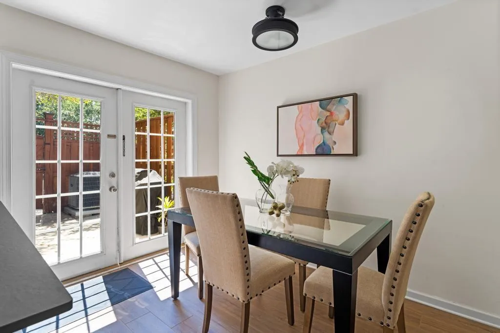 Dining area with french doors and wood finished floors