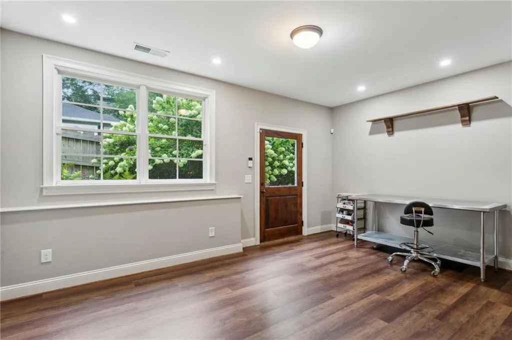 Flexible space on the terrace level could be a craft room with door to the side yard and pool