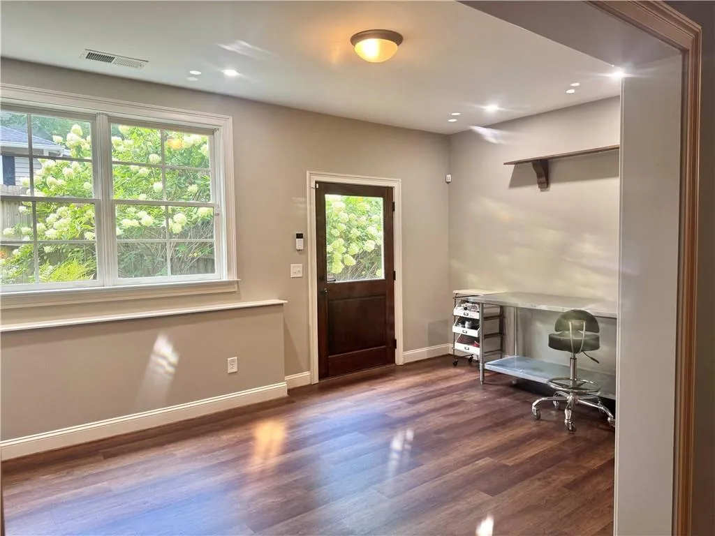 Bright room, perfect for crafts, with exterior door to backyard and pool