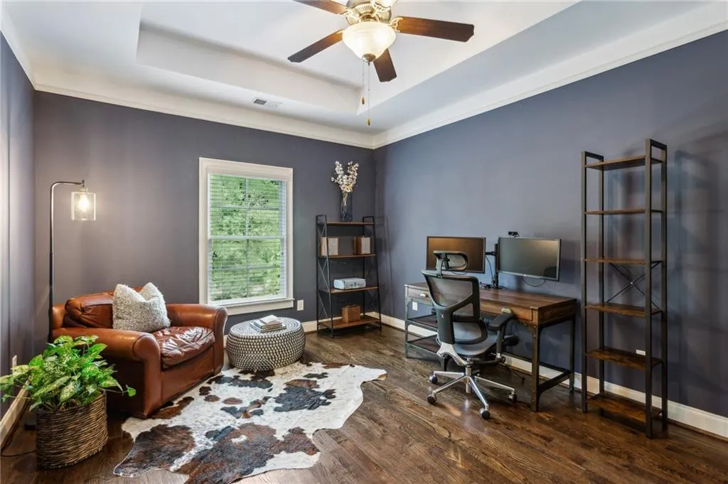 Bedroom #5 with hardwood floors, currently used as an office