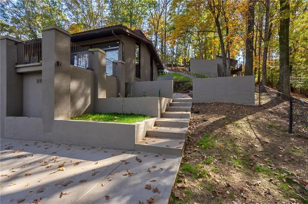 View of side of property featuring a balcony