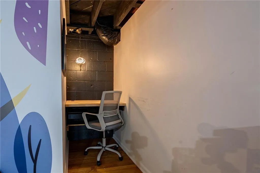 Office area featuring wood-type flooring