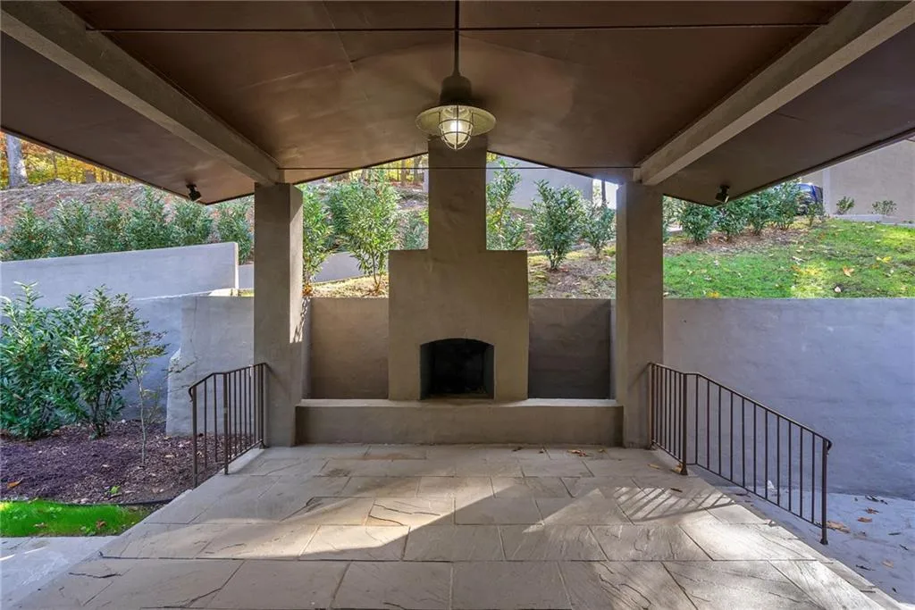 View of patio / terrace with exterior fireplace