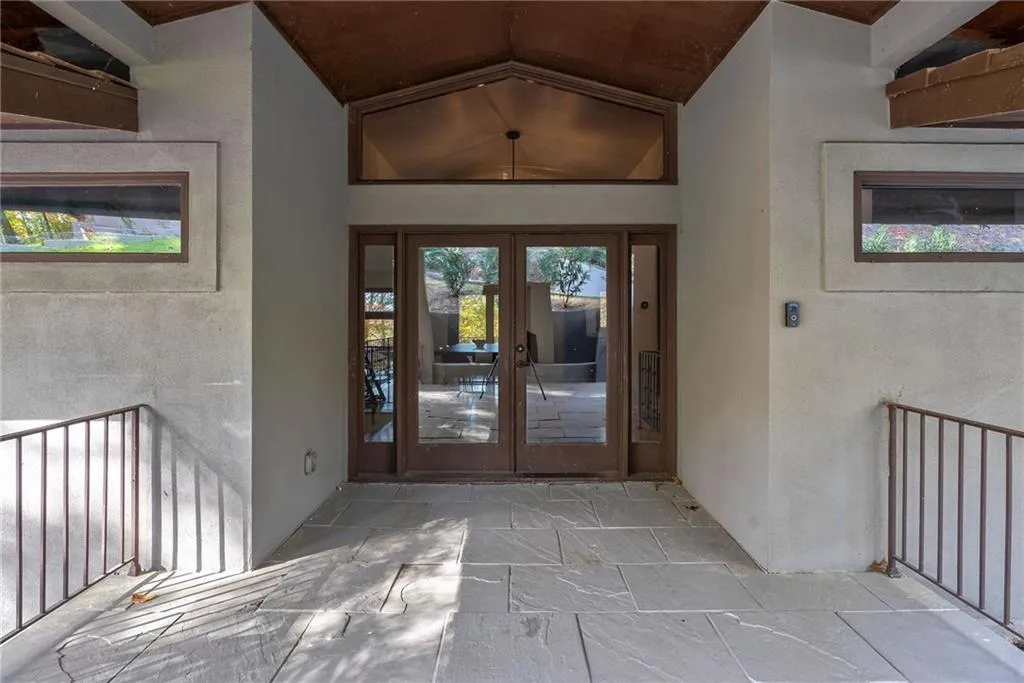 Doorway to property featuring french doors