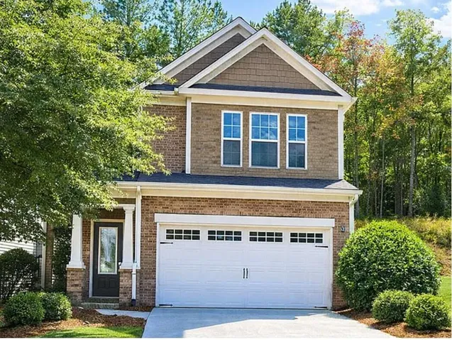 Brick and shingle exterior with white trim